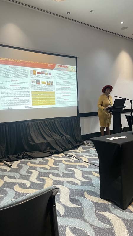 Mikateko Mafuyeka presented on COVID-washing in social media advertising by the food and beverage industry in South Africa at PHASA2022